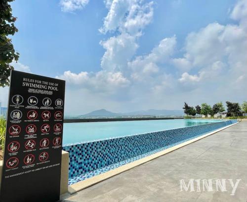 a sign that is next to a swimming pool at Netizen walk to MRT 4-5pax in Cheras
