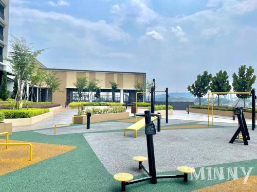a playground with swings and benches in front of a building at Netizen walk to MRT 4-5pax in Cheras