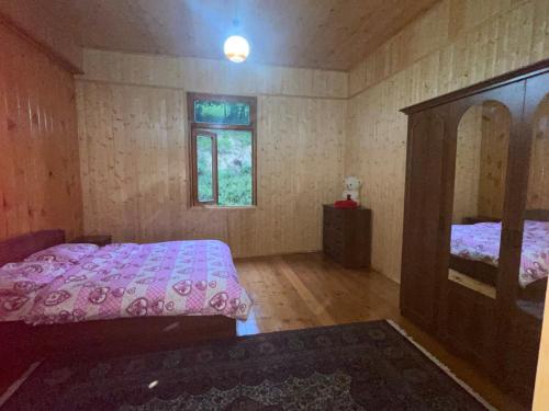 a bedroom with a bed and a dresser and a mirror at Mountain Heaven 