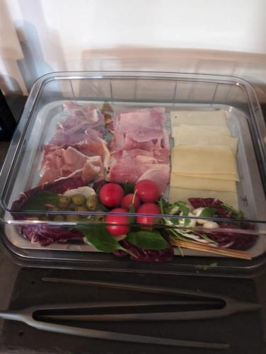 a refrigerator filled with different types of food at Al Faro Bianco B&B e Residence con parcheggio in Vasto