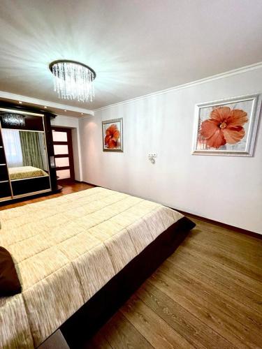 a bedroom with a large bed in a room at Marius Homestay in Chişinău