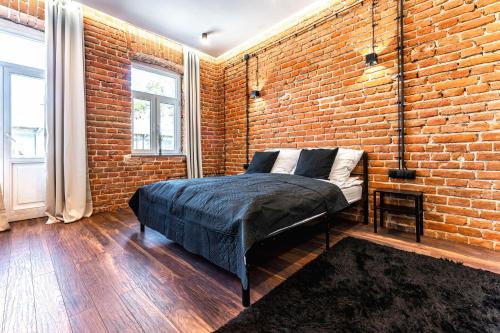 Giường trong phòng chung tại Wasz Metraż Lubartowska