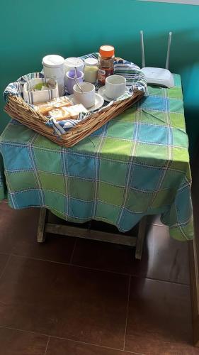 a table with a tray of food on top at Cabañas El Viejo Sauce in Tandil