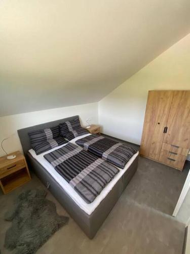 a bedroom with a bed in a room with at Ferienwohnung Louis in Passau