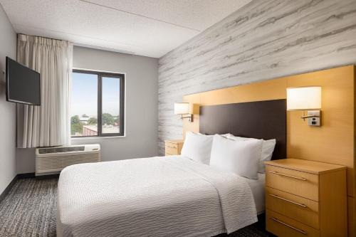 a hotel room with a bed and a window at TownePlace Suites by Marriott Harrisburg West/Mechanicsburg in Mechanicsburg