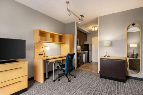 an office with a desk and a television in a room at TownePlace Suites by Marriott Harrisburg West/Mechanicsburg in Mechanicsburg