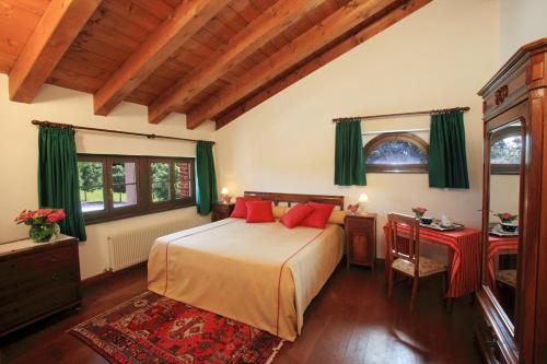 Postel nebo postele na pokoji v ubytování Agriturismo Scacciapensieri