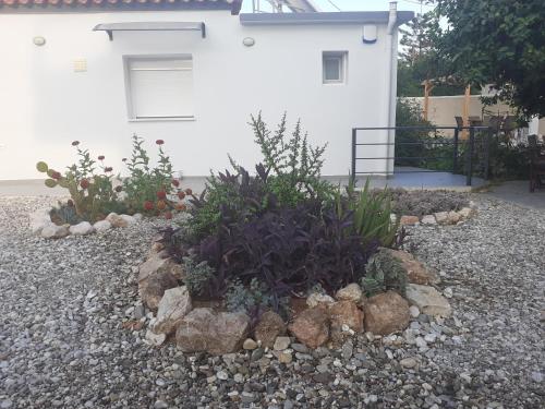 a rock garden in front of a house at Michael's Greek House in Argos