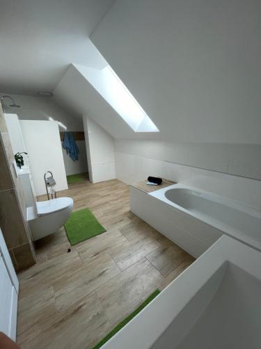 a bathroom with a sink and a bath tub at Vila Mima in Nová Lesná