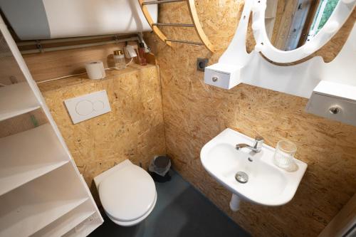 a small bathroom with a toilet and a sink at Horní Strakův mlýn in Úštěk
