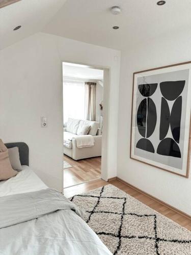 Postel nebo postele na pokoji v ubytování Stilvolle Wohnung im Allgäu