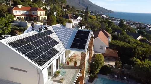 an aerial view of a house with solar panels on the roof at Far Horizons Camps Bay in Cape Town