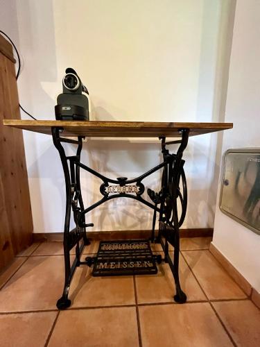 a wooden table sitting on top of a table at Kaproun - Studený pramen in Kunžak