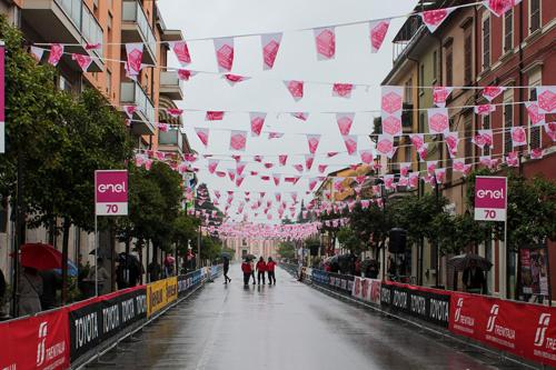 a city street with pink hearts and white flags at lontani da casa in Borgofranco dʼIvrea