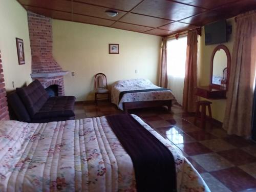 Postel nebo postele na pokoji v ubytování Cabañas del Coronel