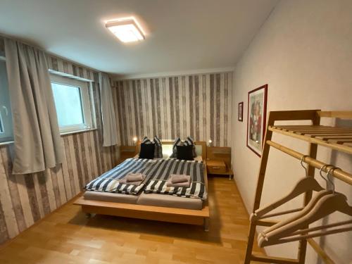 a bedroom with a bed in a room at Schöne Aussicht Sauerland by Kölbel Familienurlaub mit Hund in Schmallenberg