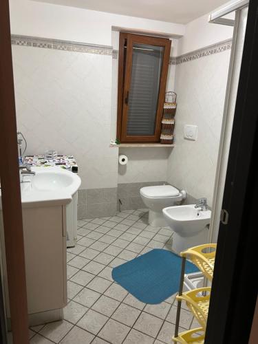 a bathroom with a sink and a toilet at Villa Isa in Rio Marina