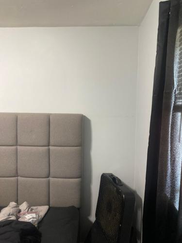 a bedroom with a bed and a tv in a room at Nice stay in Calumet City. in Calumet City