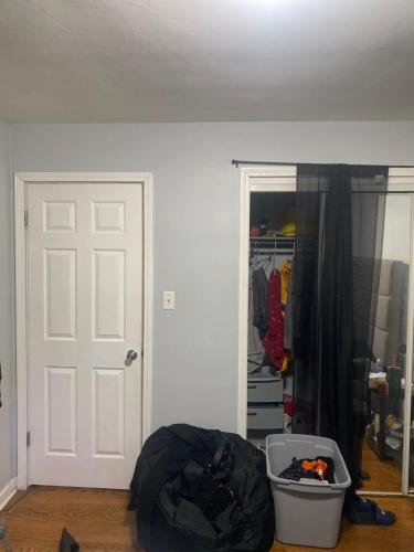 a room with a white door and a closet at Nice stay in Calumet City. in Calumet City