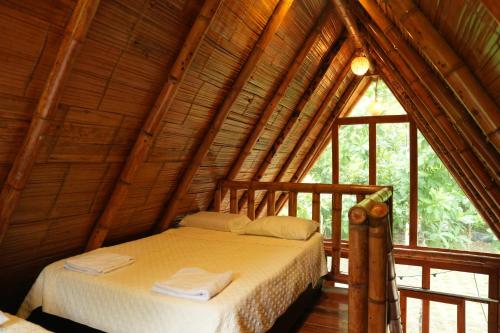 Llit o llits en una habitació de Tiny Houses Unique Tayrona - Dentro del Parque Tayrona