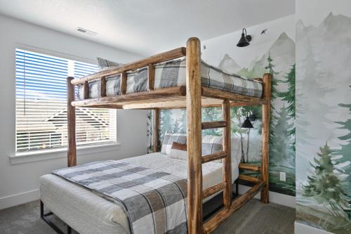 a bedroom with a bunk bed with a mountain mural at The Willow at McCall in McCall