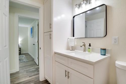 a white bathroom with a sink and a mirror at Salem Vacation Rental Near Parks and Vineyards in Salem