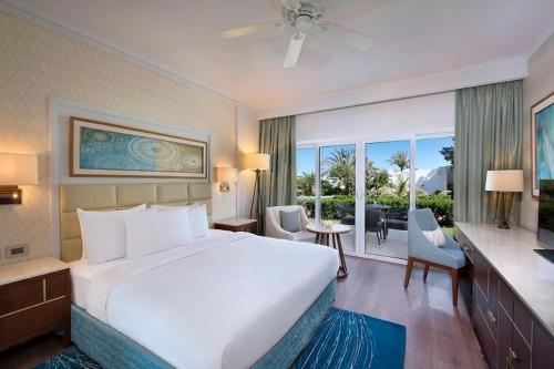 a bedroom with a large bed and a large window at Hotel studio in Sharm El Sheikh