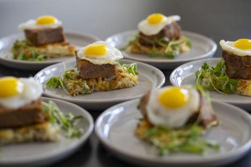 a group of plates of food with eggs on them at Torrance Marriott Redondo Beach in Torrance