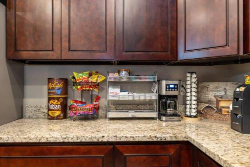 a kitchen with a counter with a refrigerator at Luxury Home Downtown NAU Route 66 Snowbowl in Flagstaff