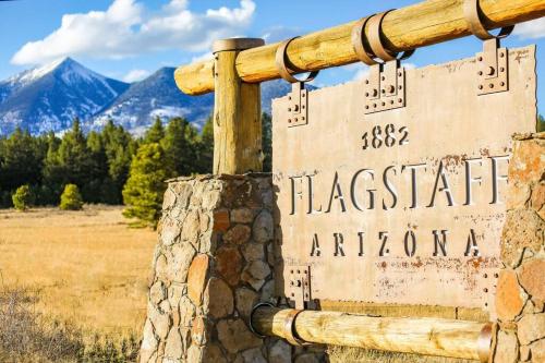 a sign for the flaceratarian american sign in the mountains at Luxury Home Downtown NAU Route 66 Snowbowl in Flagstaff