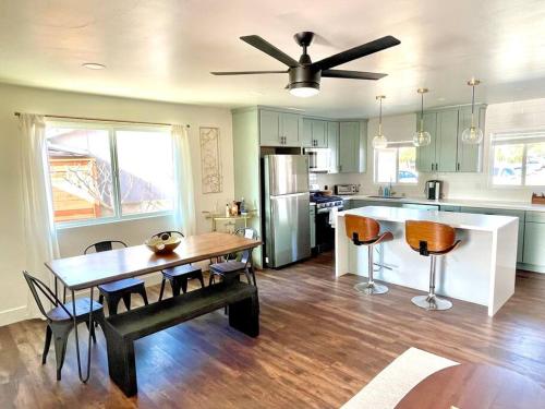 a kitchen with a table and chairs and a dining room at Modern Home with View and Large Private backyard in San Diego