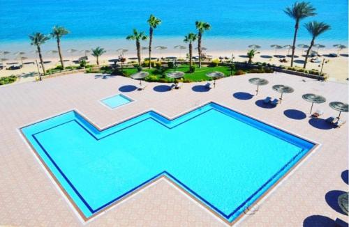 an overhead view of a pool at the beach at Luxury large Apartment 2 bedroom all rooms with amazing sea view in Hurghada