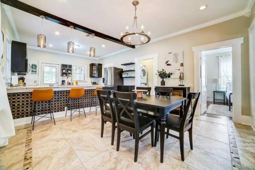 a dining room and kitchen with a table and chairs at Southtown Downtown Home Walk to Riverwalk in San Antonio
