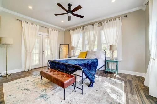 a bedroom with a bed and a ceiling fan at Southtown Downtown Home Walk to Riverwalk in San Antonio