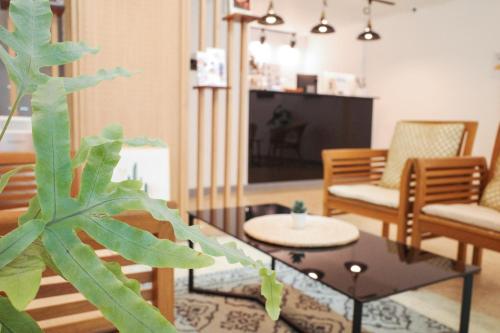 a living room with a couch and a table at Starria Hostel foreign guest only in Seoul