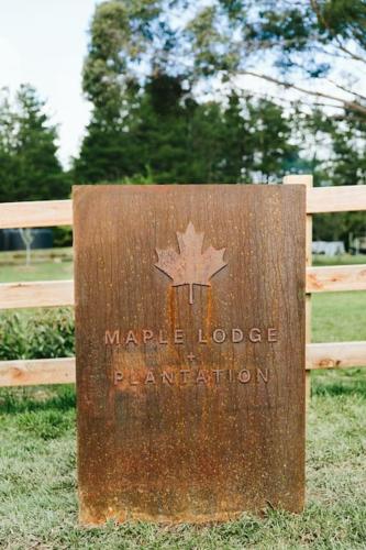 a sign that says maple lodge ranger station at The Maple Lodge with Alpacas, Goats, Boars, Ducks & Chickens Farm Stay with Outdoor Pizza Oven in Robertson
