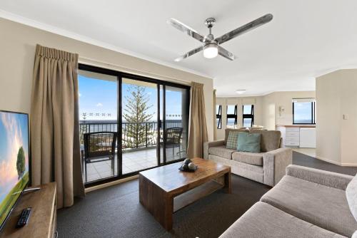 a living room with a couch and a table at Gena Apartments Unit 13 Kings Beach QLD in Caloundra