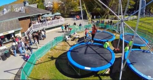 a crowd of people standing around a playground at Mountain View Suite on Jiminy Peak Ski On Off -New in Hancock