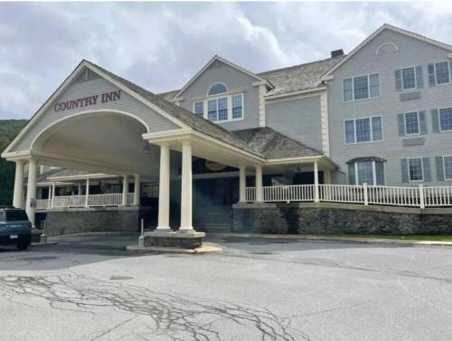a house with a car parked in front of it at Mountain View Suite on Jiminy Peak Ski On Off -New in Hancock