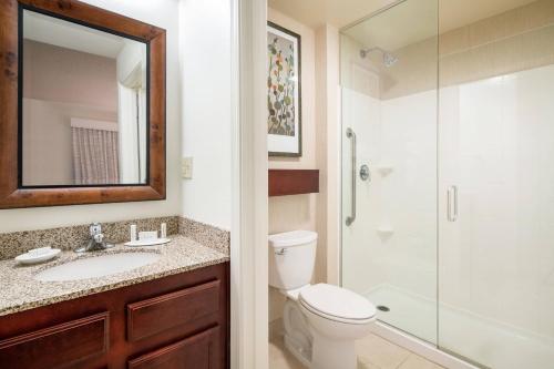 a bathroom with a toilet sink and a shower at Residence Inn Phoenix Desert View at Mayo Clinic in Phoenix