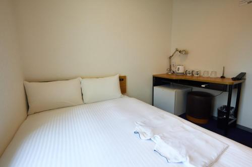 Postel nebo postele na pokoji v ubytování 8 Hotel Shonan Fujisawa