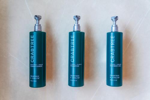 three batteries sitting next to each other on a wall at DoubleTree by Hilton Bangkok Ploenchit in Bangkok