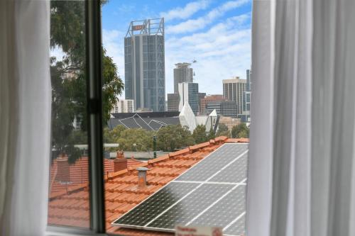 a view from a window of a roof with solar panels at Malibu Apartments - Perth in Perth