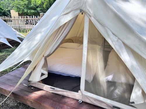 Postel nebo postele na pokoji v ubytování Touching Camping
