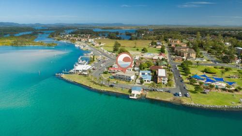an aerial view of a small island in the water at Lakeside 3 in Tuncurry