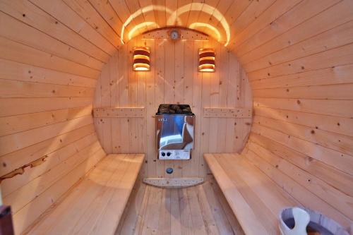 an inside view of a sauna with a tv in it at Ventoura Studios & Apartments in Galissas
