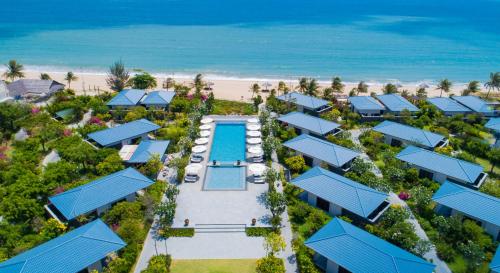 an aerial view of a resort with a pool and the beach at Hoan My Resort - Ninh Chu in Phan Rang–Tháp Chàm