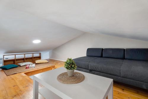 a living room with a couch and a table at Torviscas Endless Summer in Adeje