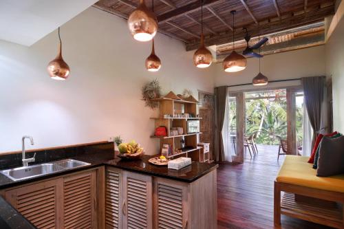 a kitchen with a sink and a counter at Villa with amazing rice field view between Canggu and Ubud in Penebel