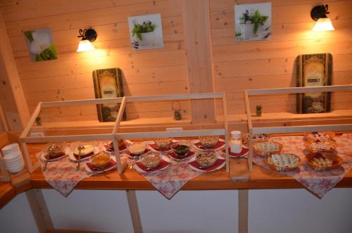 a table with a bunch of food on it at Pension zum Schreiner in Hermagor